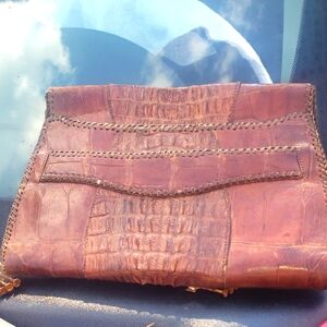 I have a vintage alligator clutch 1930 or 40's its in great shape
